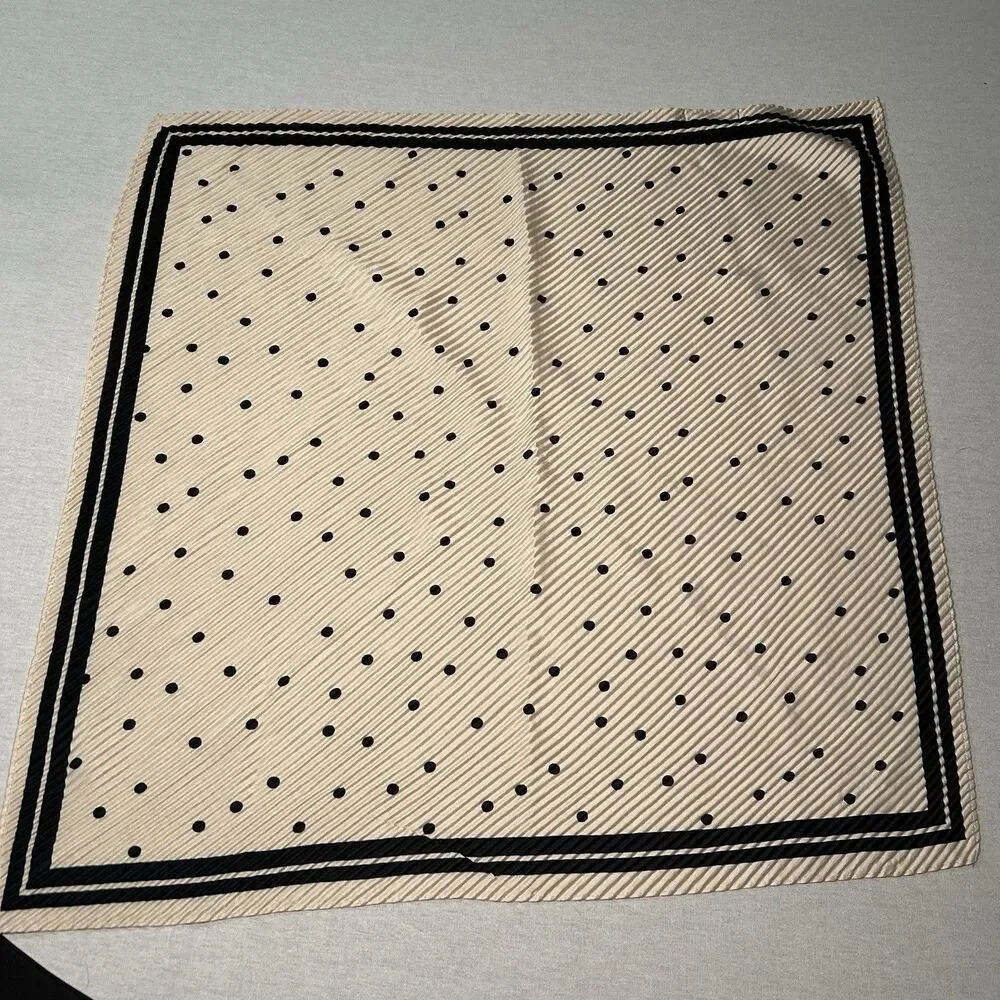 Reserved cream polka dot scarf, bold black border, pleated texture